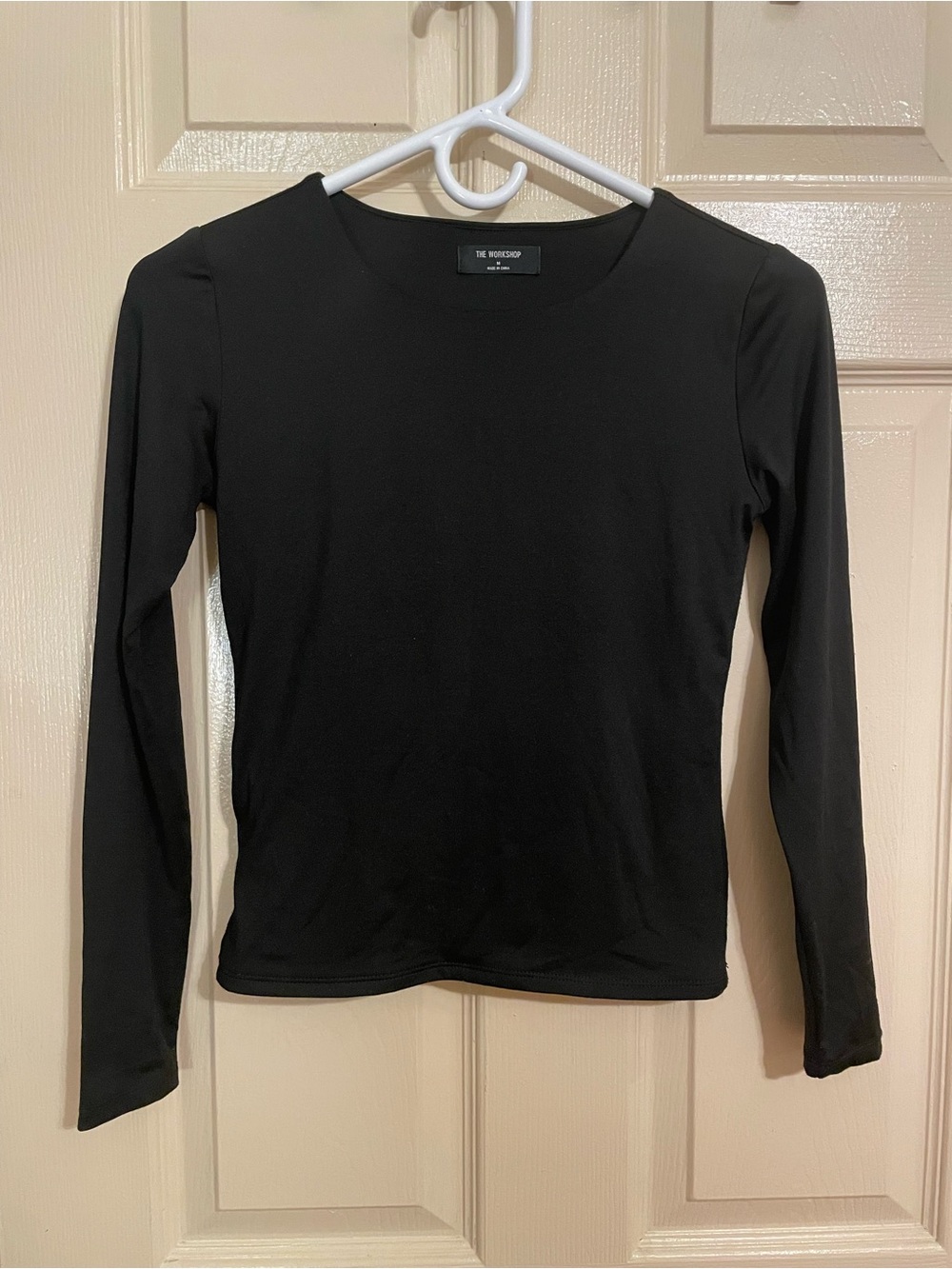 The Workshop Studio form-fitting black bodysuit top